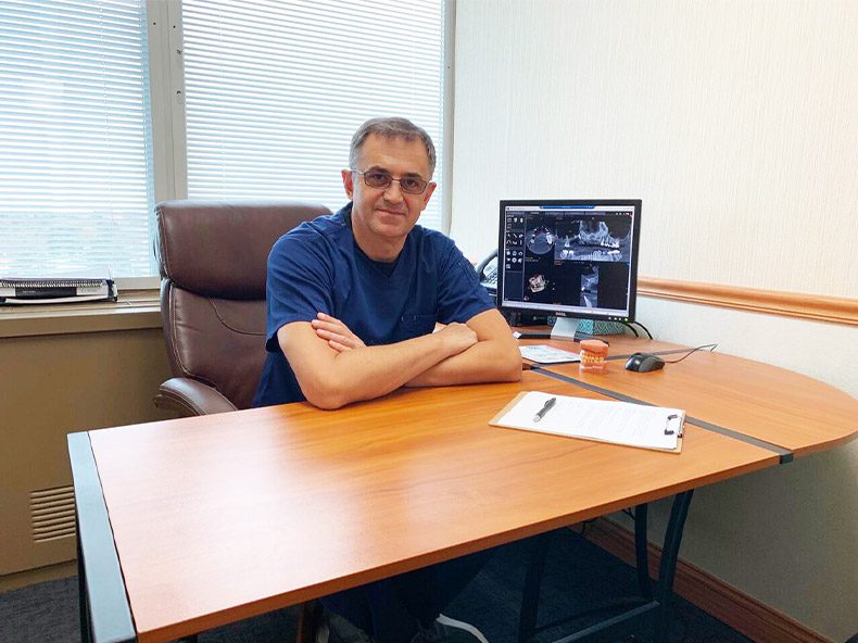 Dr. Fedin sitting at his desk