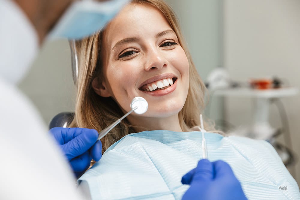 Female visiting dentist for missing teeth